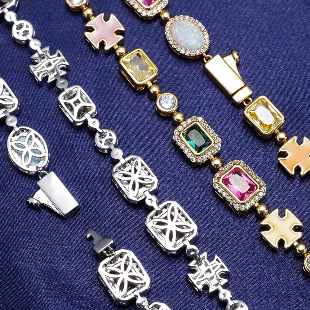 MIMOTTA CREED on navy satin, detail of clasps and stones