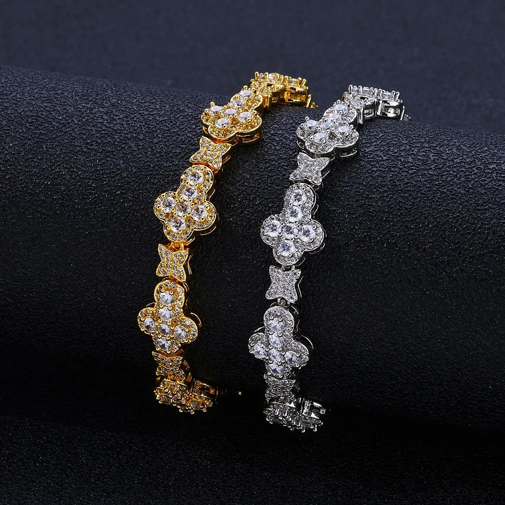MIMOTTA DYNASTY tennis bracelets in gold and silver tone on dark fabric